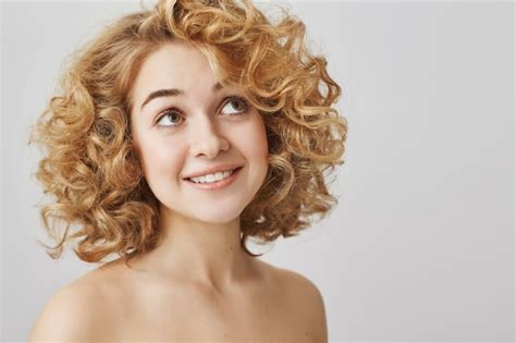 Free Photo Beauty And Fashion Concept Dreamy Curly Haired Girl With Naked Shoulders Smiling