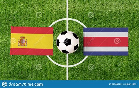 Top View Soccer Ball with Spain Vs. Costa Rica Flags Match on Green 