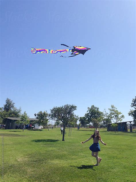 Girl Flying Kite At A Park By Dina Giangregorio Stocksy United