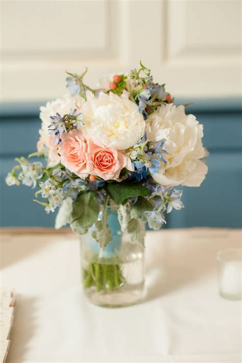 For a wedding with a faraway feel, stick with bold colors. Pink, White and Blue Flower Arrangements