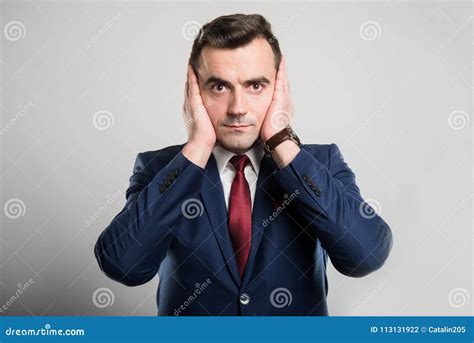 Attractive Business Man Covering Ears Like Deaf Gesture Stock Photo