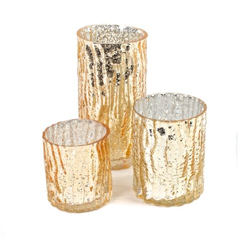 Create an elegant display of gold and candlelight with this three piece set of gold mercury glass candle holders. Gold Mercury Glass Candle Holders | Candle Votives Set of 3