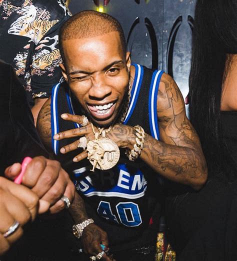Tory Lanez Shows Off His Chain In A Supreme Jersey And Amiri Jeans