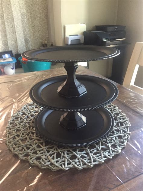 Three Tiered Cake Plate Sitting On Top Of A Table