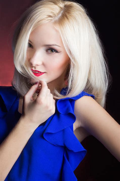 Elegant Beautiful Girl Blonde With Red Lips In A Blue