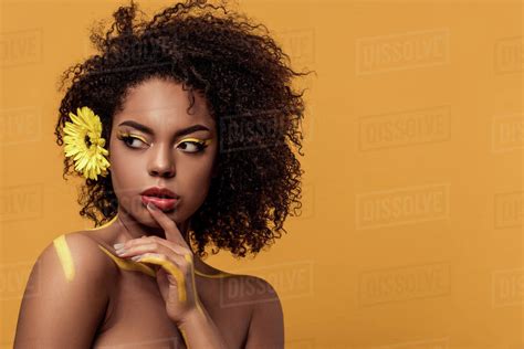 Babe Bright African American Woman With Artistic Make Up And Gerbera In Hair Holds Hand By Her