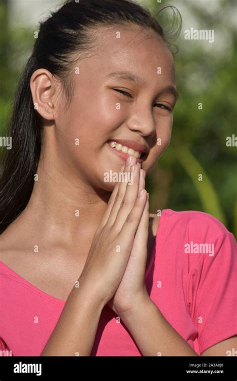 A Praying Diverse Teenager Girl Stock Photo Alamy