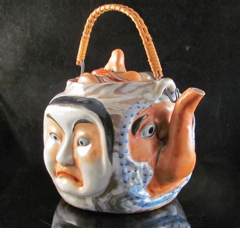 japanese 19th century banko 萬古 ware pottery teapot of noh and kyogen masks pottery teapots