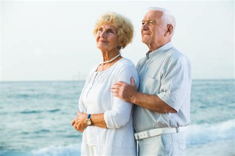 Man And Woman Standing On The Sea Shore Stock Image Image Of Rest