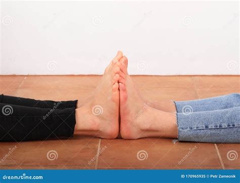 Feet Touching On Floor Royalty Free Stock Photo