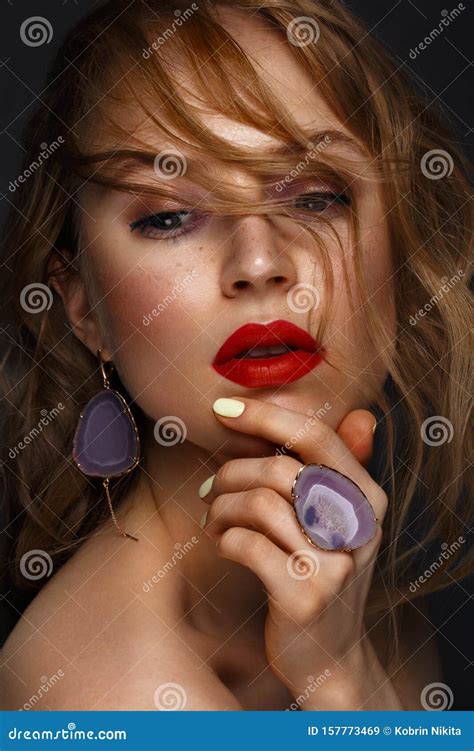 Beautiful Girl With Red Lips And Classic Makeup And Curls With Large