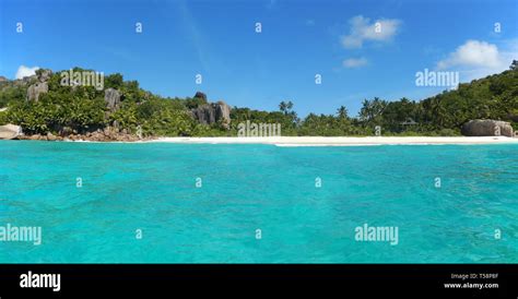 Panoramic View From Boat Of Beautiful Remote Beach In The Seychelles
