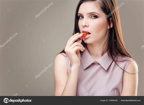 Sexy Woman Eating Strawberry Sensual Lips Manicure And Lipstick Desire Stock Photo By