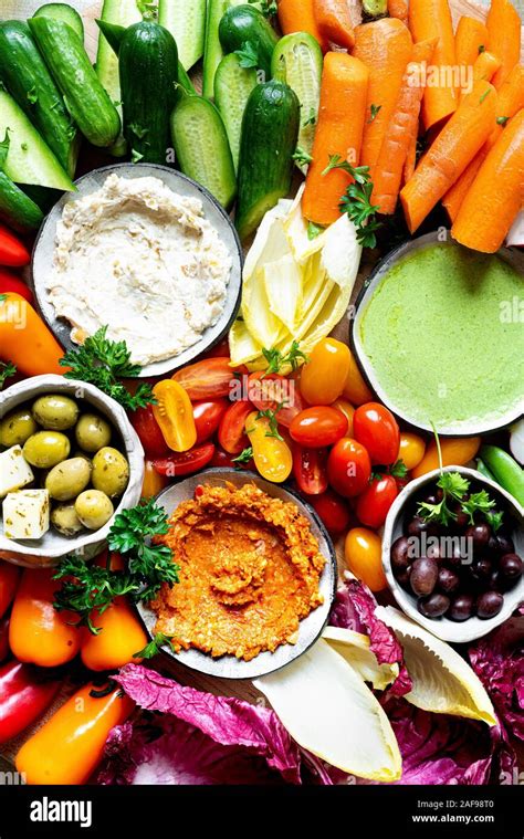 Assorted Raw Vegetable Appetizer Platter With Three Dips Stock Photo