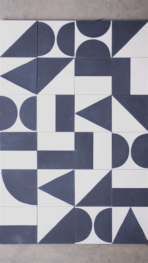 Mix Of White And Blue Cement Tiles In Different Geometric Tile Patterns