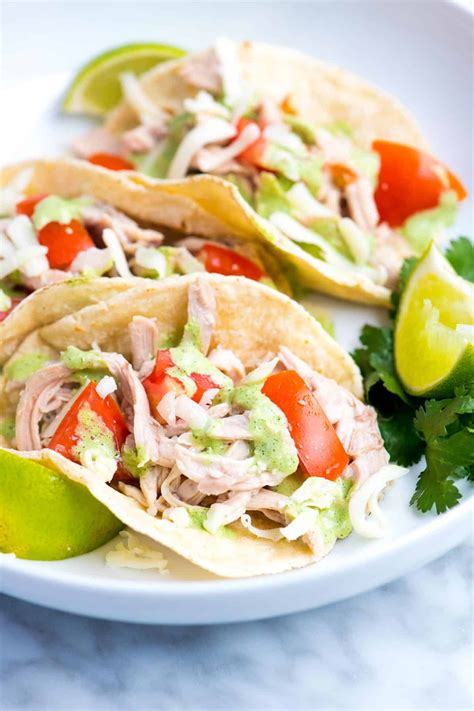 In a 3 1/2 quart to 4 quart slow cooker, place chicken thighs. Shredded Chicken Tacos with Creamy Cilantro Sauce | Recipe ...