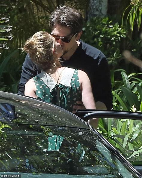 Amber Heard Plants A Kiss On Her New Beau Andy Muschietti