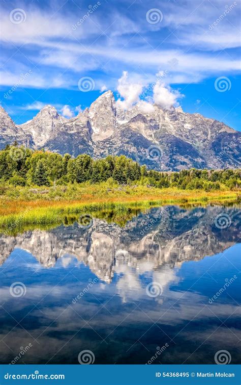 Scenic View Of Grand Teton Mountains With Water Reflection Usa Stock