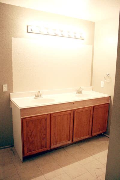 Bathroom vanities can be 30 inches to 36 inches tall. Remodelaholic | How to Raise Up A Short Vanity