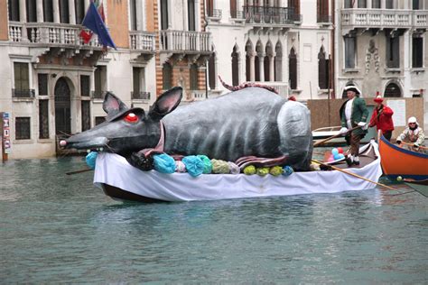 A Large Rat Float Floats Down A Canal