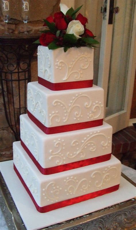 Red Ribbons Against Gold Or Ivory Icing Navy Blue Wedding Cakes