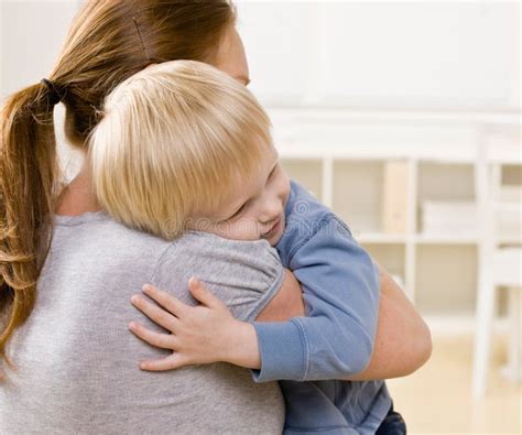 Mother Hugging And Comforting Her Son Stock Photo Image Of Close