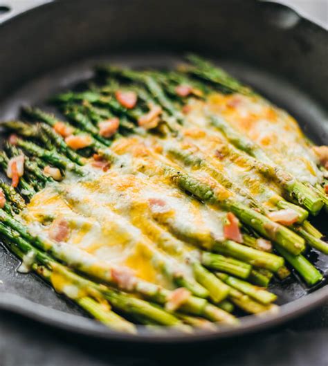 Topped with crispy bread crumbs and parmesan cheese this baked asparagus with breadcrumbs does just that. Cheesy Baked Asparagus with Bacon - Savory Tooth