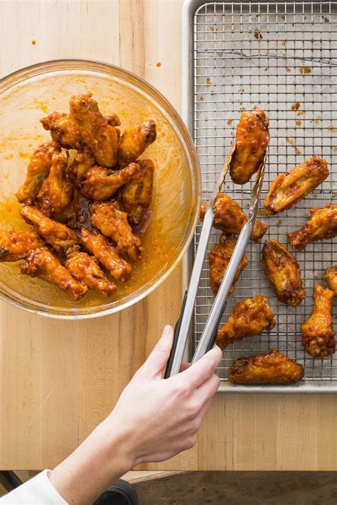 Using tongs, remove wings from batter one at a time, allowing any excess batter to drip back into bowl, and add to hot oil. Korean Fried Chicken Wings from America's Test Kitchen - cleveland.com