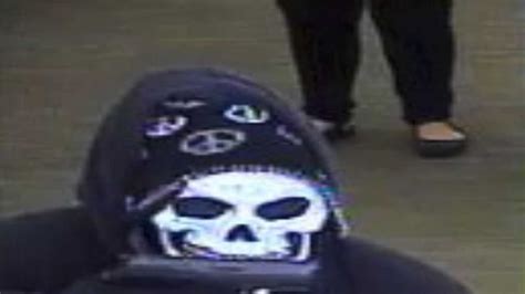 Masked Bank Robber Drops Cash After Dye Pack Bursts