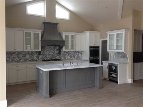Shaker white wall cabinets with a luna pearl granite with a subway backsplash. Shaker white kitchen fluted grey island - Beach Style ...