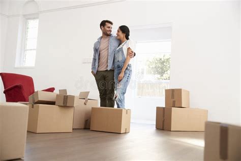 Couple Carrying Boxes Into New Home On Moving Day Stock Photo Image