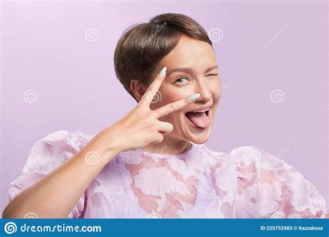 Photo Portrait Of Beautiful Playful European Young Woman Short Haircut Blue Eyes Pink Puffy