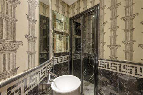Toilet With Ornate Decoration In The Roman Empire Style With Mirrors