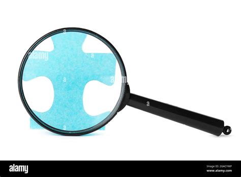 Magnifying Glass Searching For Missing Puzzle Pieces Stock Photo Alamy