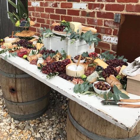 Wedding Grazing Table On A Timber Door And Wine Barrels