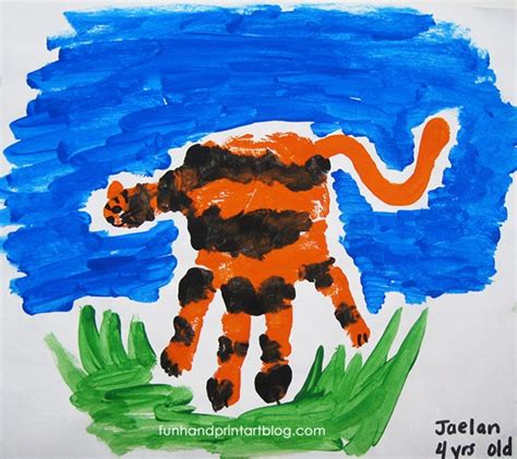 How To Make A Handprint Tiger Craft With Kids Fun Handprint Art