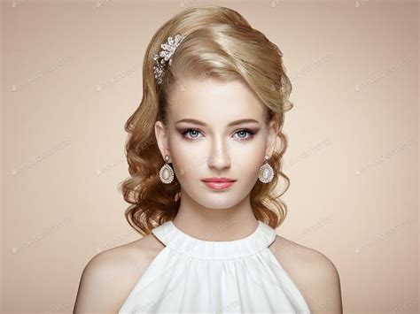 Fashion Portrait Of Young Beautiful Woman With Elegant Hairstyle By