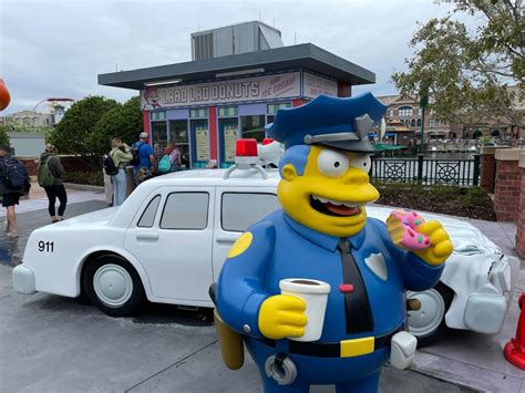Photo Real Police Officer Fills Out Paperwork On Fake Springfield Cop Car After Guest Is Caught
