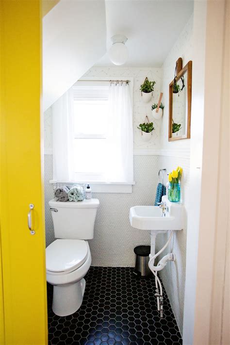 On the side is a traditional white commode decorated with a flower holder as well as expanding trees. How To Decorate A Tiny Bathroom On A Budget