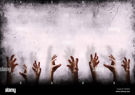 Grungy Wall With Scary Hands Reaching Out Stock Photo Alamy