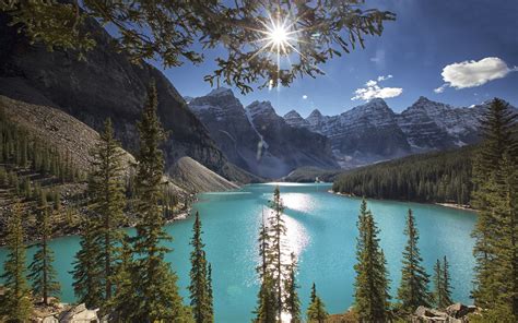 Wallpaper Moraine Lake Trees Mountains Sun Rays Canada 1920x1200 Hd Picture Image