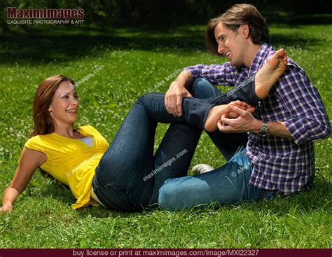 Young Man Tickling Young Womans Feet Stock Photo Mxi22327