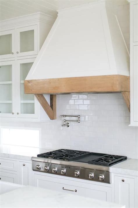 Gorgeous Kitchen Features A White French Hood With A Rustic Wood Trim