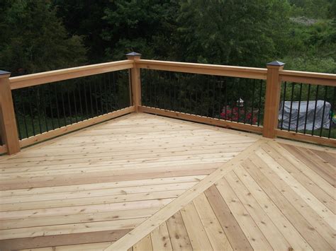 Horizontal barrels made of wrought iron, welded metal railings and coated aluminum form an inexpensive but elegant deck railing. Cedar Deck Railing Pics • Decks Ideas