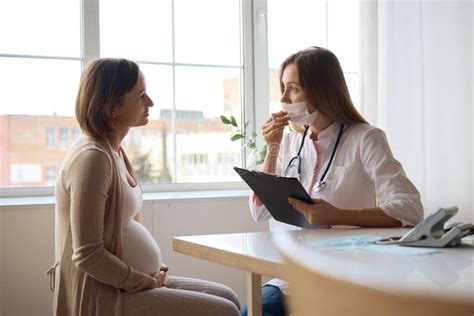 Happy Pregnant Woman Visit Gynecologist Doctor At Hospital Or Medical