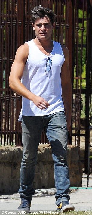 Zac Efron Shows Off His Guns In A Wifebeater But Co Star Seth Rogen