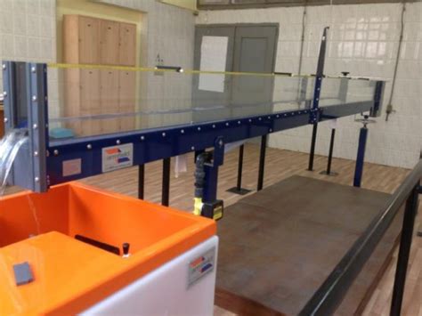 For the measured depths, y1, y2 and y3, determine if the flow is subcritical or supercritical. Hydraulic jump experiment in a rectangular open channel flume