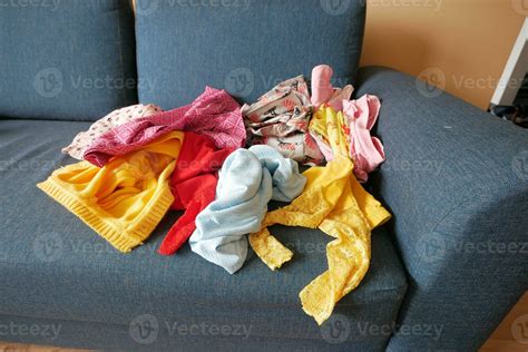 Messy Clothes On Sofa At Home 32036539 Stock Photo At Vecteezy