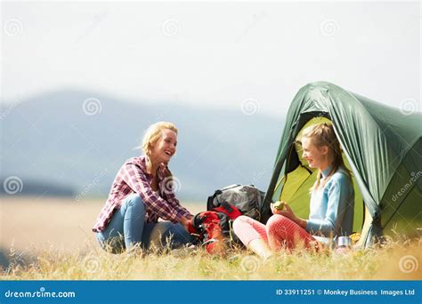 Two Teenage Girls On Camping Trip In Countryside Stock Image