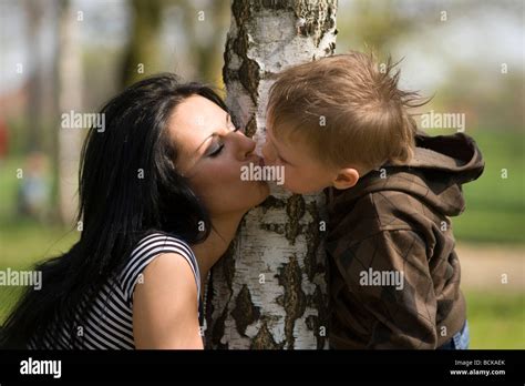 Mother Kissing Son Stock Photo Alamy